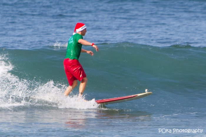 Christmas in Hawaii - See someone surfing in a Santa hat