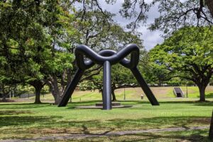 Isamu Noguchi (1904–1988) is one of the twentieth century’s most important and critically acclaimed sculptors. His sculpture "Sky Gate" was dedicated in April 20, 1977 and sits in the Frank Fasi Civic Grounds lawn between Frank Fasi Municipal Building (FMB) and Honolulu Hale. Responding to the island’s wind, sky, and mountains, Noguchi designed “Sky Gate” as a wide-open portal, to link the earth and the cosmos.